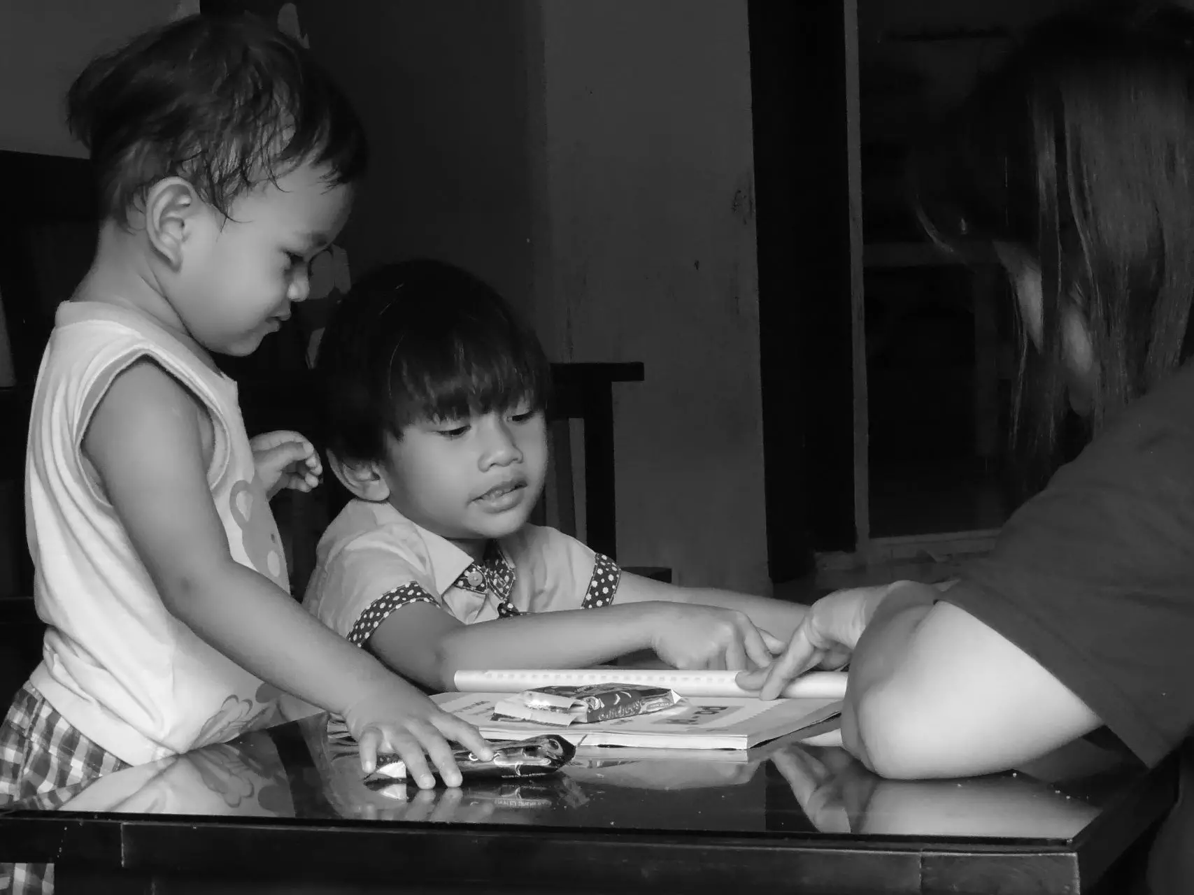 Cute baby boy old brother home learning how read alfabet from mother
